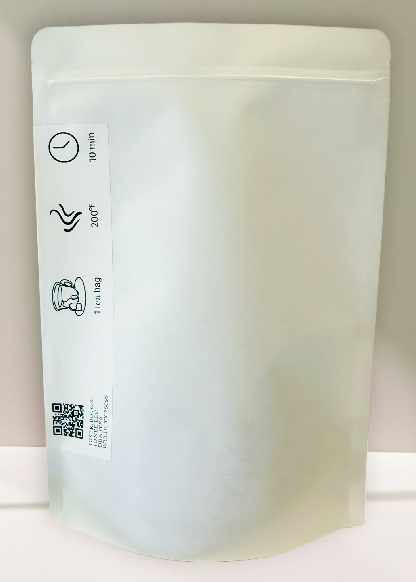White stand-up pouch with labels and a QR code on a white background