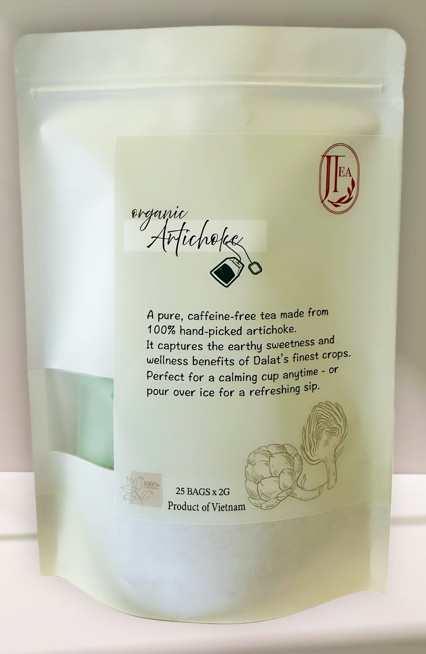 Tea package with organic artichoke tea description on a white background