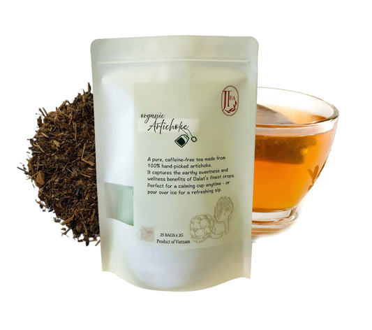 Tea packaging with loose tea leaves and a brewed cup on a white background