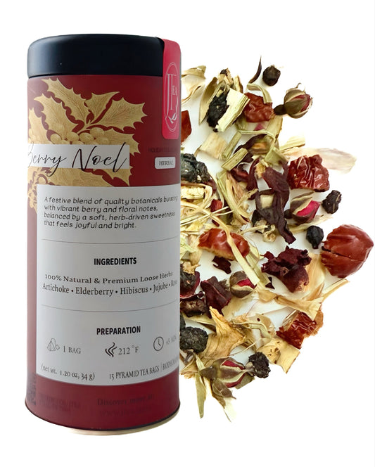 Tea canister labeled 'Berry Noel' with a scattering of tea leaves on a white background